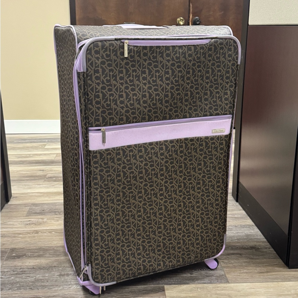 Calvin Klein Monogrammed Brown and Lavender Luggage